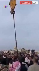 Beşar Esad'ın kuzenini şehrin meydanında astılar