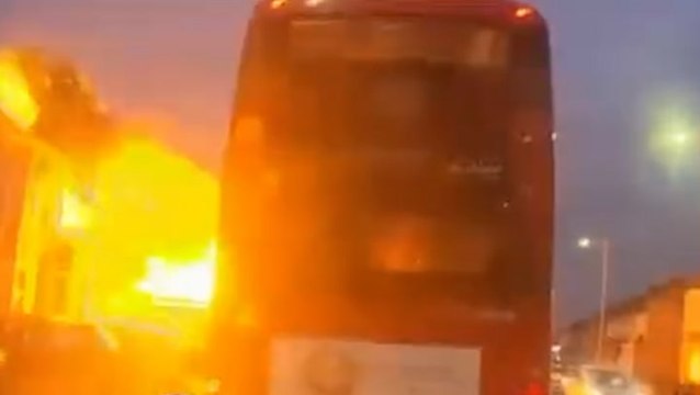 Watch: House explodes in fireball metres away from bus