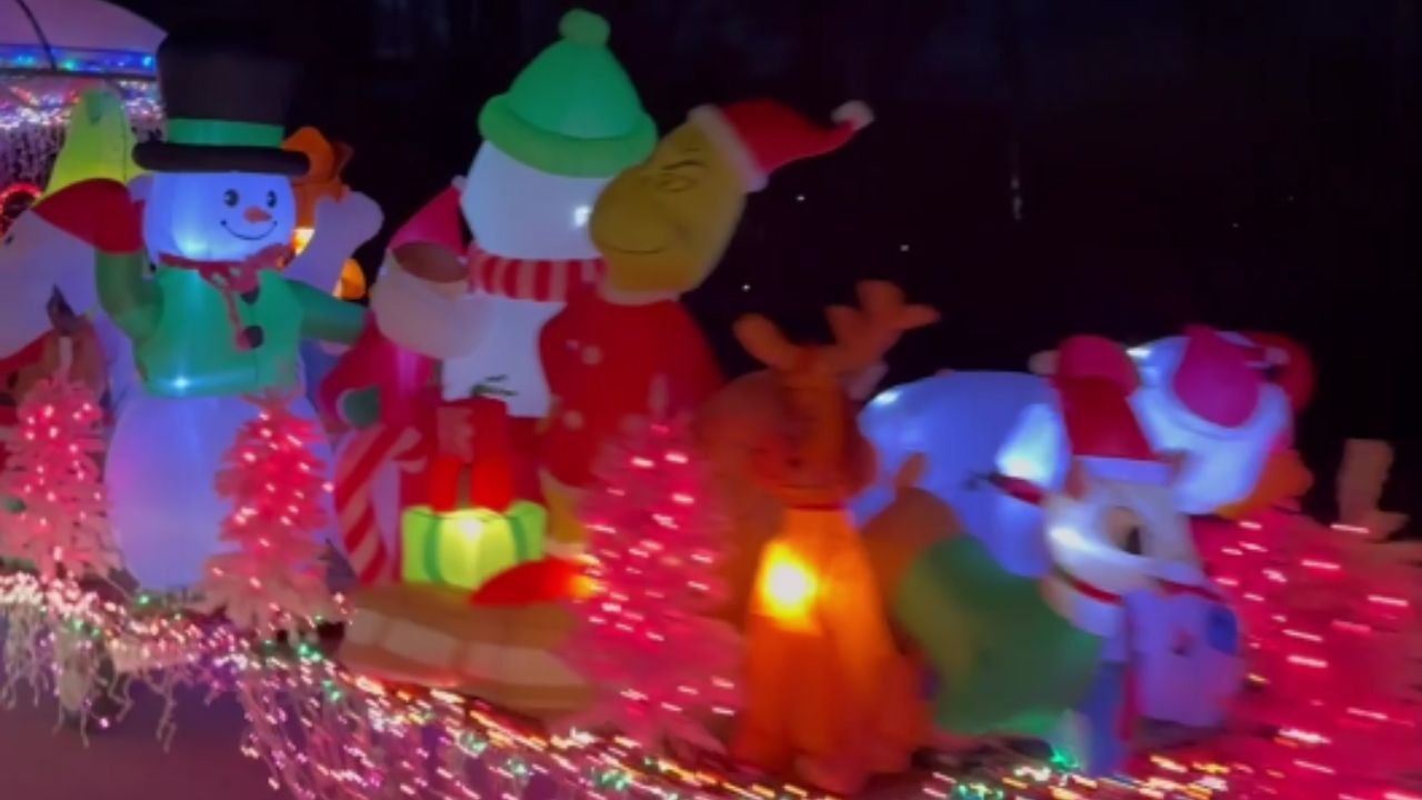 Christmas spirit shines bright on a trailer decked out with lights and festive displays