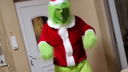 Young boy begins to cry as Grinch visits his home while others feel excited