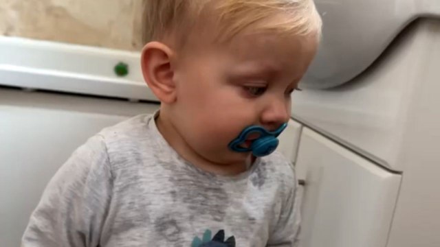Toddler bursts into tears over not being allowed to sit on lap while using toilet