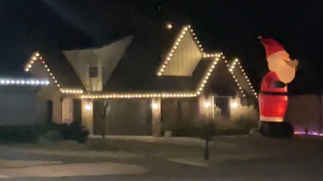 Jenks neighborhood becomes Santa Claus Lane with over 10 giant Santas in yards