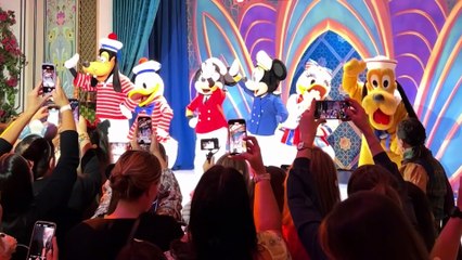 Bennett chats with Joe and Captain Minnie on the Grand Hall of the Disney Treasure