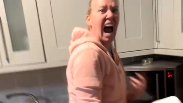 Mom lets out a loud scream as son scares her while she cooks