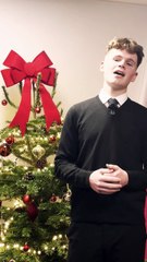 Michael Lewis sings 'It's Beginning to Look a Lot Like Christmas'.