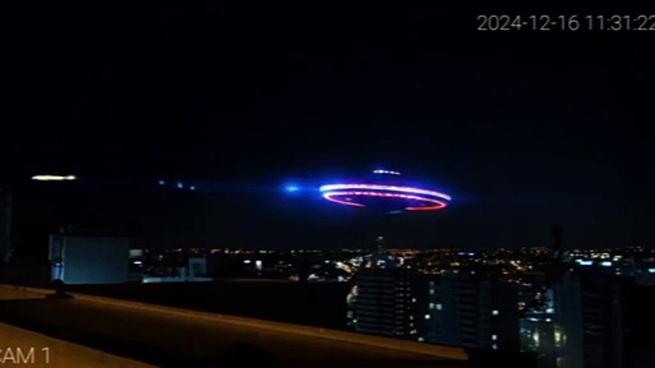 A fixed surveillance camera on a building in New York detects a flying saucer