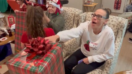 Sisters delightfully surprised with Christmas trees during a heartwarming family gathering