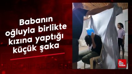 Babanın oğluyla birlikte kızına yaptığı küçük şaka