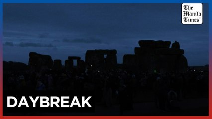 Thousands greet the sun at Stonehenge to celebrate winter solstice