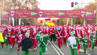 Unas 9.000 personas vestidas de Papá Noel y elfos recorren Madrid por una causa solidaria