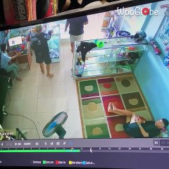 Men sprint to safety after monitor lizard makes a terrifying grand entrance