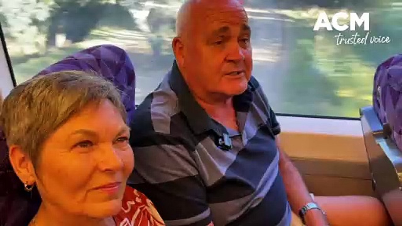 WATCH: A Corryong couple heading to the Melbourne hospital rally share their concerns during the V/Line trip.