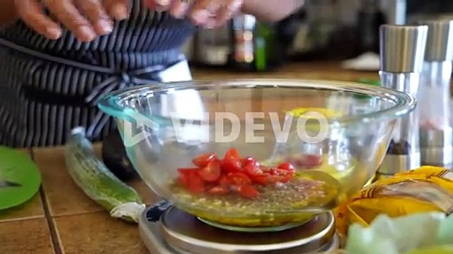Adding cut tomatoes to the olive oil, vinegar, and shallot dressing for a chopped salad - ANTIPASTO SALAD SERIES