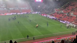 Leeds United celebrate going top in the mist at Stoke