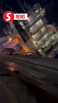 Cargo ship rolls onto its side at an Istanbul port