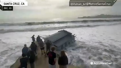 Rough surf breaks off part of the Santa Cruz Wharf