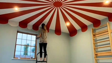 Muralist transforms nursery into circus tent-themed playroom