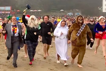 Hundreds of 'superheroes' take to the sea for the 2024 Tenby Boxing Day Swim