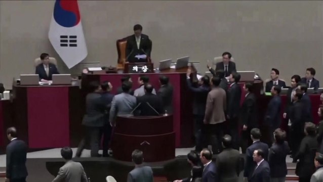 Chanting South Korean ruling party lawmakers swarm parliament in protest of impeachment vote
