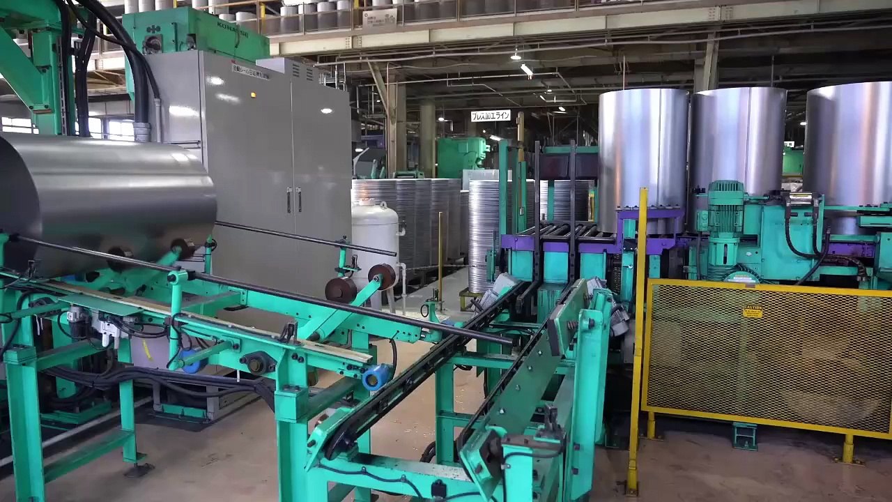 The process of manufacturing drums on a large scale at a mass production facility in Japan.