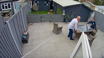 Glass breaks into pieces as gentleman repositions it for Christmas dinner setup