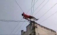 Drunk Man Climbs Electric Pole, Performs Stunts on Live Wires in Andhra Pradesh  In a bizarre incident in M. Singipuram, Palakonda Mandal, Andhra Pradesh, a drunken man stunned villagers by climbing an electric pole and performing stunts on live wires.  T