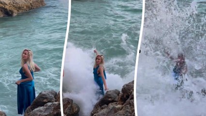 Model gets dragged underwater by huge wave in the middle of a photoshoot