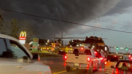 Unsettling cloud formation creates eerie scene with a striking contrast of light and dark