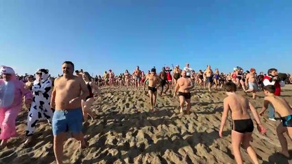 Hundreds of people take a New Year's dip in southern France