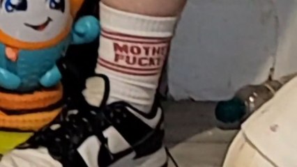 Mom notices her sister’s inappropriate socks with a swear word and feels concerned
