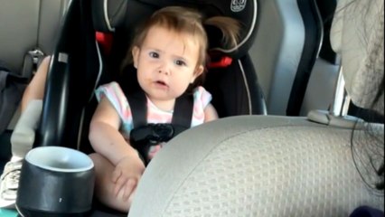 One-year-old shows her annoyance when records by her mother in car