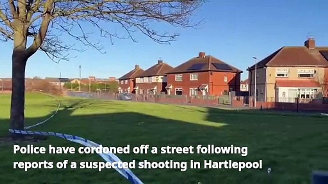 Police cordon off road following suspected shooting