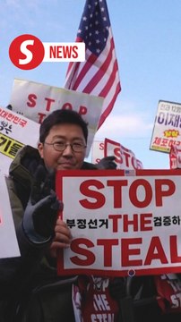 Thousands brave freezing weather to rally for and against impeached president Yoon