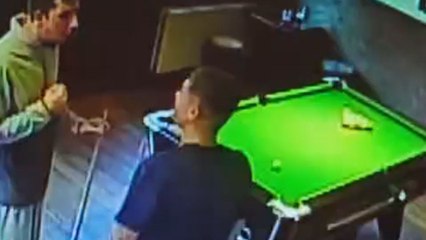 Cue ball flies off table and hits woman in head during pool game