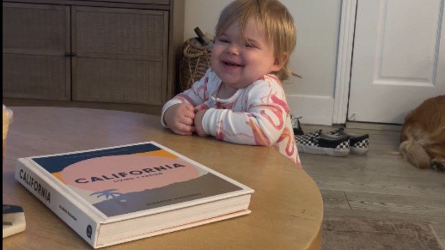 13-month-old baby babbles and giggles as she tries to communicate