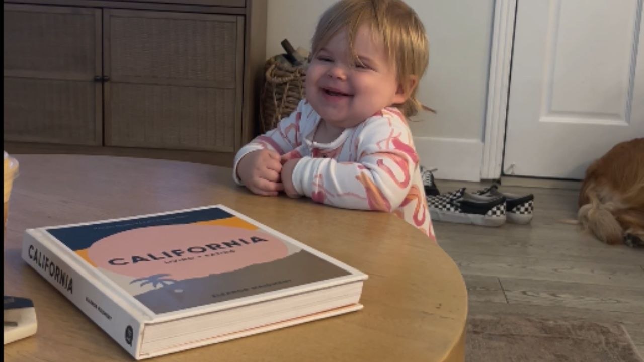 13-month-old baby babbles and giggles as she tries to communicate