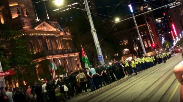 Sydney mourners hold vigil outside town hall for innocent lives lost in Palestine and Lebanon.