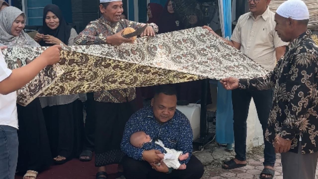Protective dad holds newborn as ritual goes off the rails with a knife flying off unexpectedly