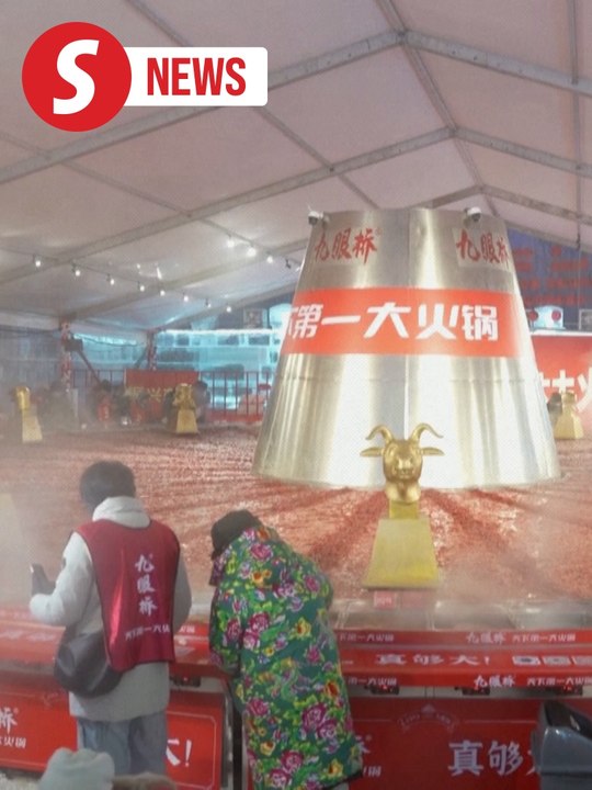 Diners warm up around massive hotpot inside ice house in China's Harbin