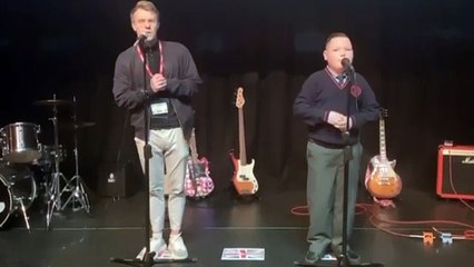 Burnley schoolboy Tommy Hartley sings with his  hero Nathan Grisdale