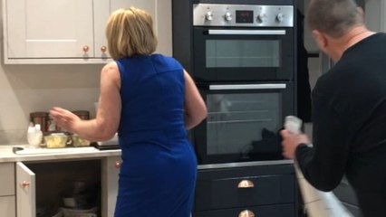 Grandma dancing at Christmas loses her balance and falls in the kitchen