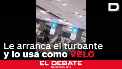 Una mujer arranca un turbante a un clérigo para cubrirse la cabeza al ser acosada por no llevar velo