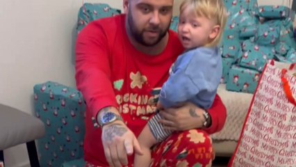 Little boy rushes into his new toy digger on Christmas morning