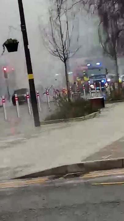 Firefighters could be seen battling a car blaze...