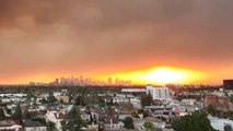 Eerie footage shows smoke-filled LA skies as deadly wildfire continues to burn