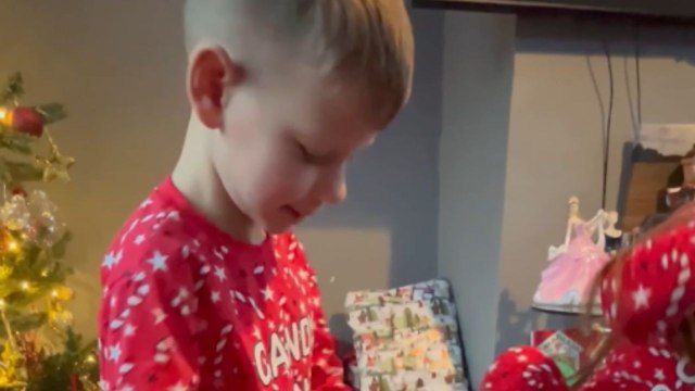 Heartwarming reaction of young boy unwrapping a new Xbox on Christmas morning