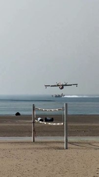 Amphibious Super Scooper airplanes from Quebec Canada are picking up seawater from the Santa Monica Bay to drop on the Palisades Fire