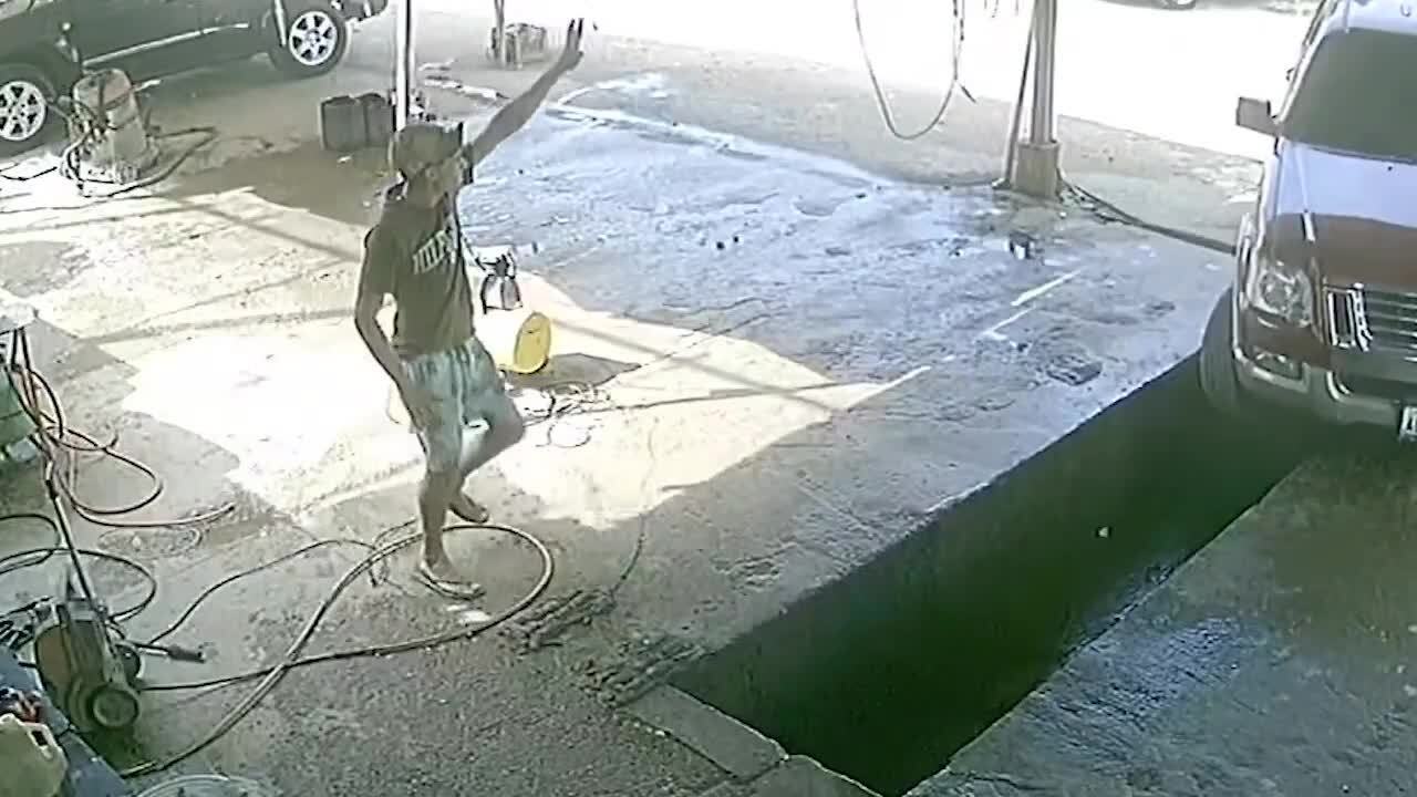 Car Falls Into Hole While Entering Car Wash