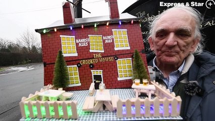 Tony Jefferies shows off the hat he has made based on the demolished Crooked House pub.