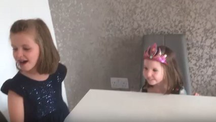 Birthday girl protests as elder sister tries to blow out her candles